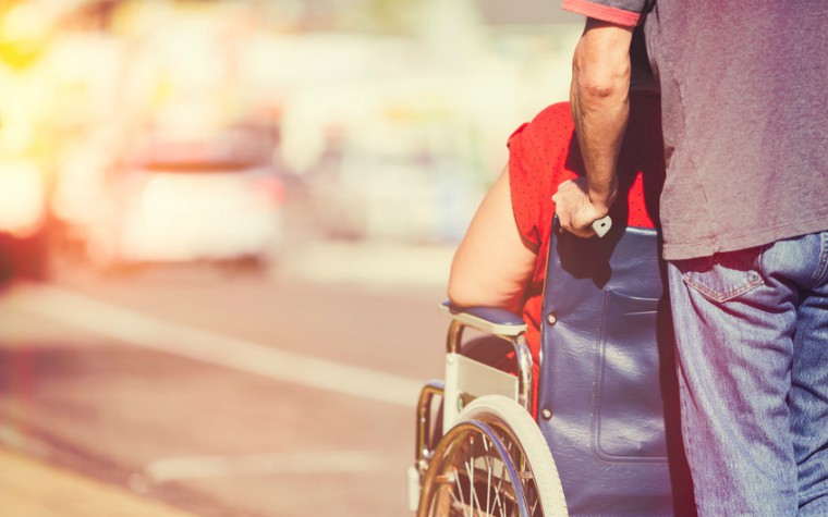 description_of_image_used_in_domestic_abuse_and_disability_quick_guide_man_pushing_woman_in_wheelchair_Jason_Stitt_Fotolia_760x475