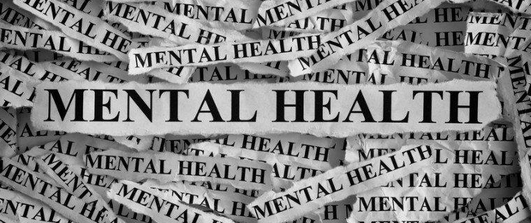 description_of_image_used_in_domestic_abuse_and_mental_health_problems_quick_guide_torn_up_pieces_of_paper_saying_mental_health_Stepan_Popov_Fotolia_760x320